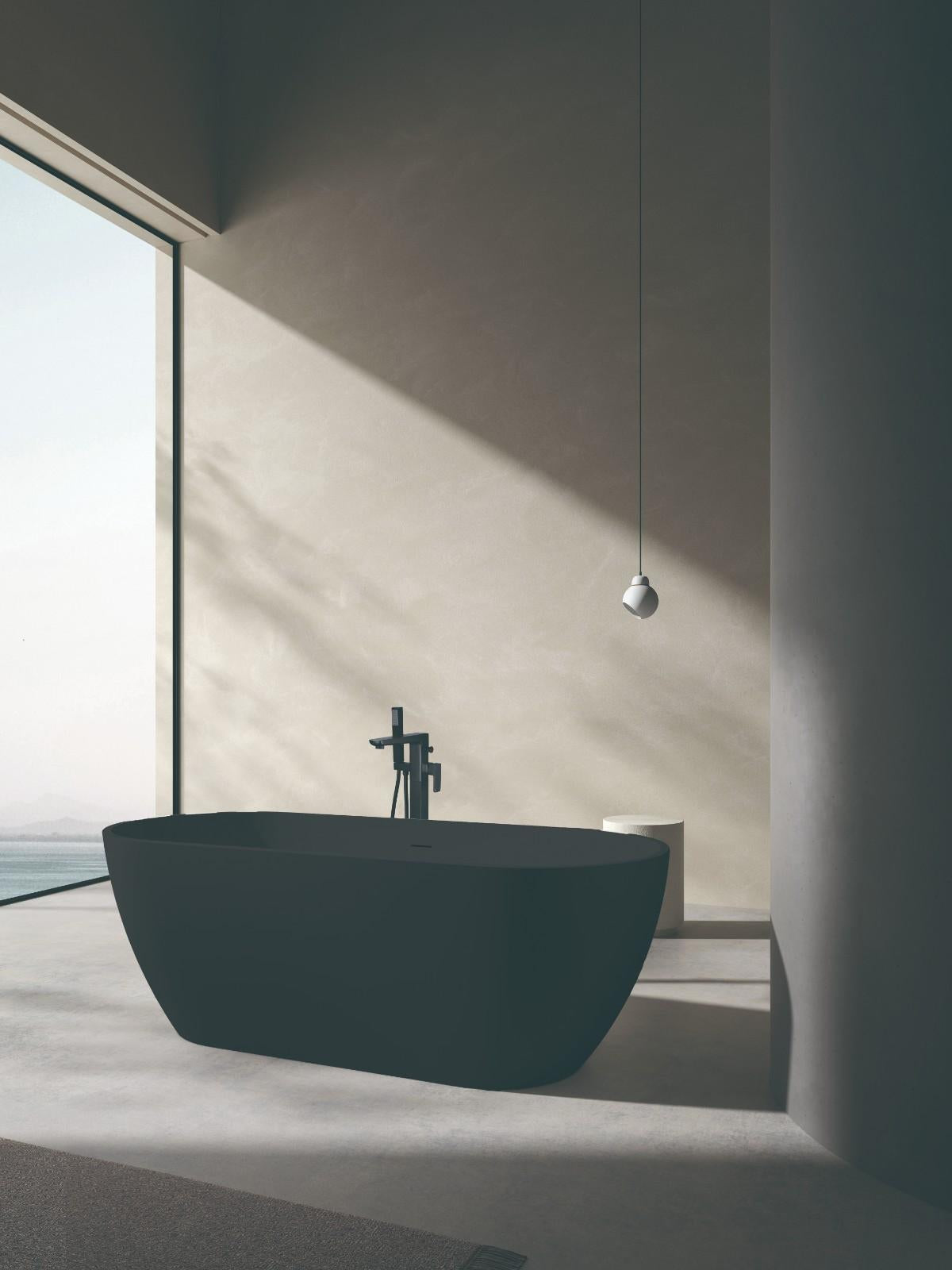 Nero matte black freestanding bath with central waste, front view